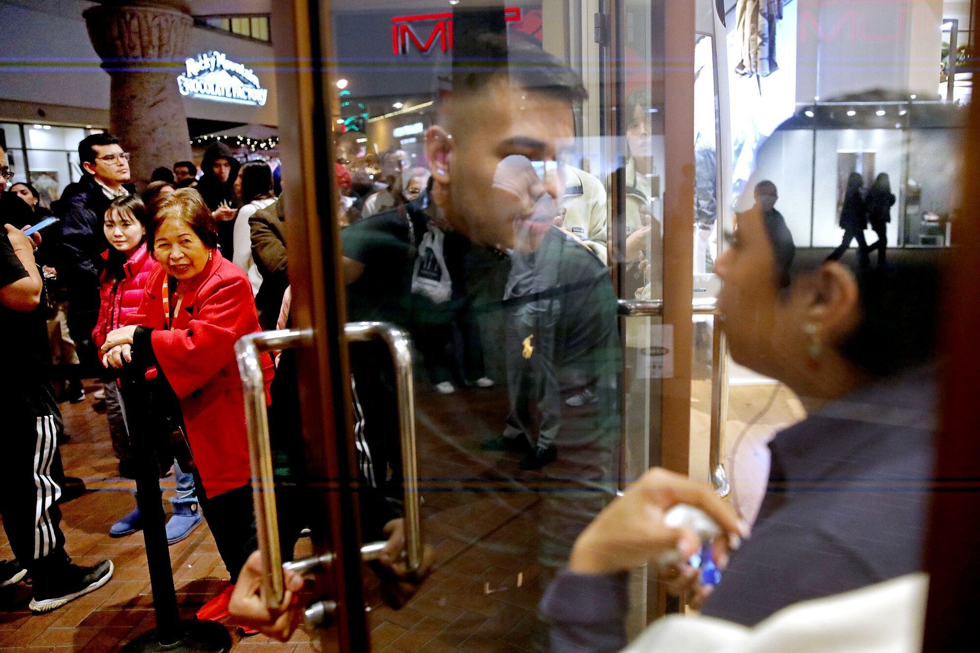 Shoppers waiting to get into the Polo Ralph Lauren Factory Store on Black Friday at the Citadel Outlets in Commerce