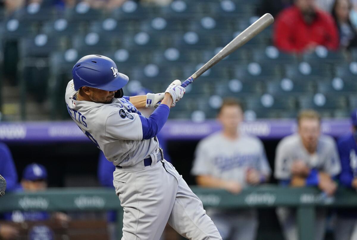 Mookie Betts connects for a double off Colorado Rockies starting pitcher Antonio Senzatela.