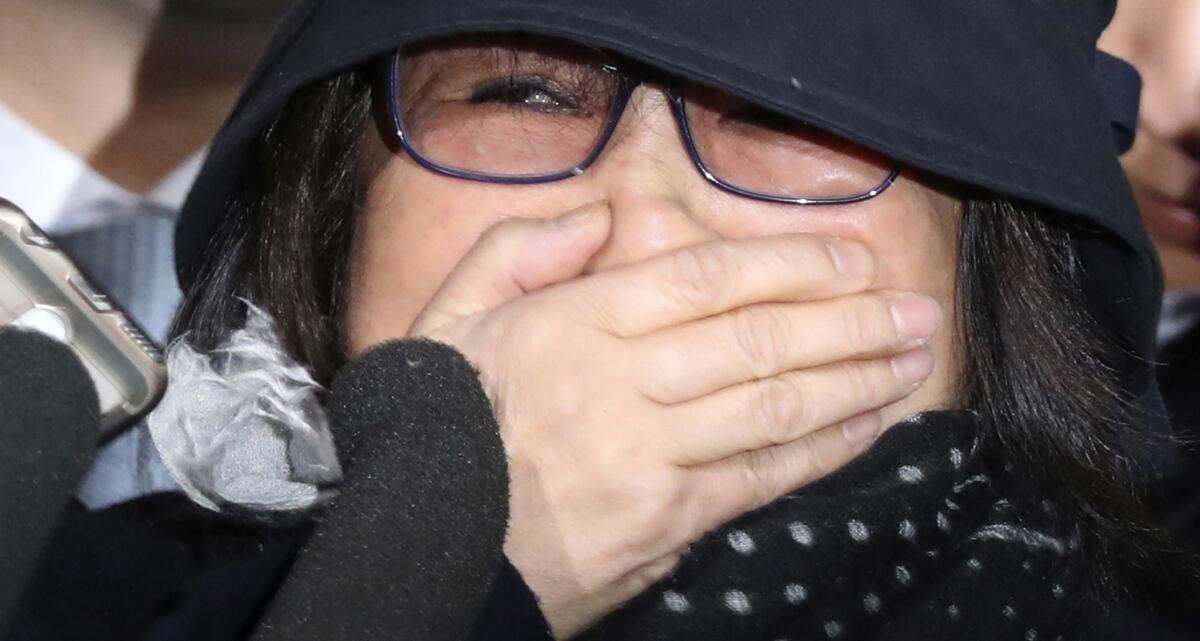 Choi Soon-sil, a cult leader's daughter with a decades-long connection to South Korean President Park Geun-hye, arrives at the Seoul Central District Prosecutors' Office in Seoul on Oct. 31, 2016.