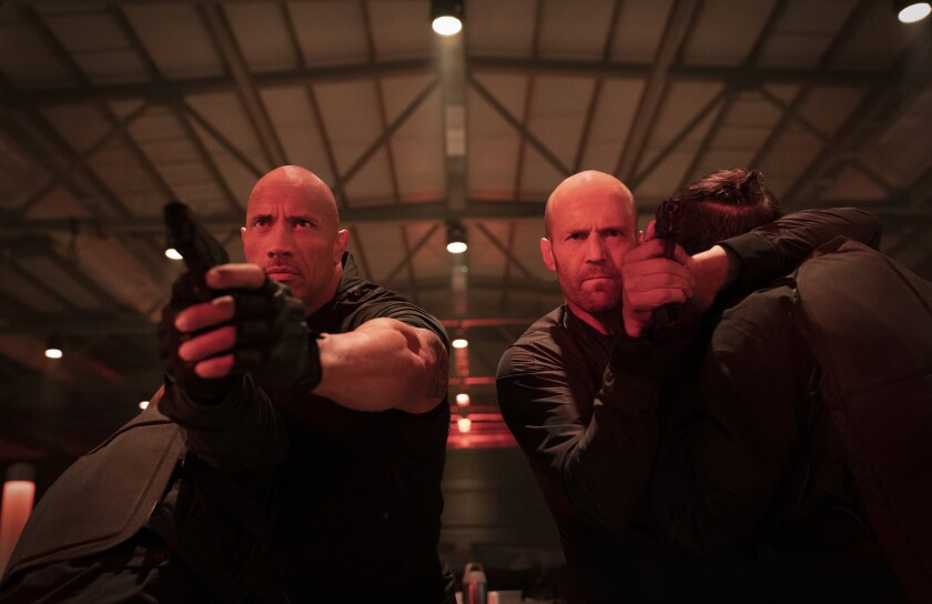 Dwayne Johnson, left, and Jason Statham in a scene from "Fast & Furious Presents: Hobbs & Shaw."