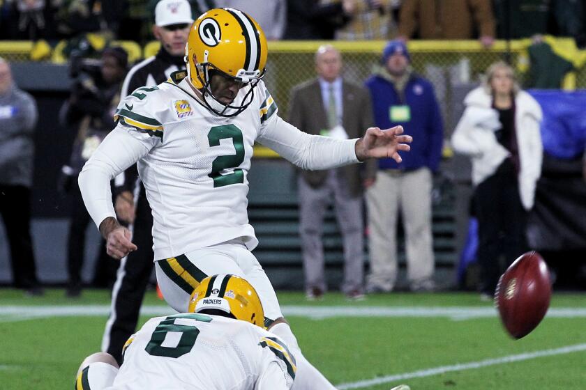 GREEN BAY, WISCONSIN - OCTOBER 14: Mason Crosby #2 of the Green Bay Packers kicks a field goal as time expires to beat the Detroit Lions 23-22 at Lambeau Field on October 14, 2019 in Green Bay, Wisconsin. (Photo by Dylan Buell/Getty Images)