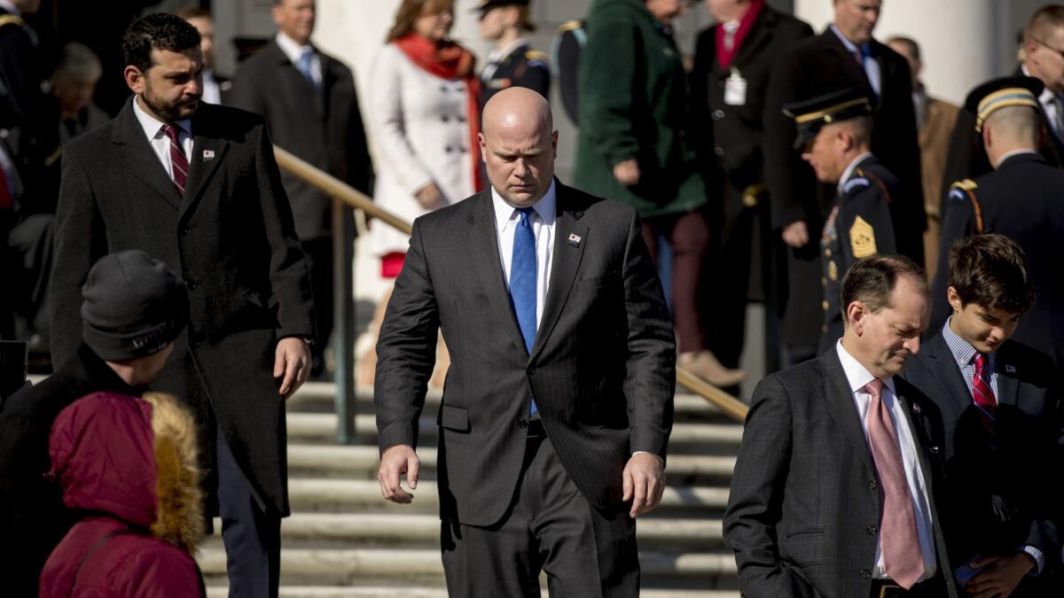Acting Atty. Gen. Matt Whitaker leaves a Veterans Day ceremony at Arlington National Cemetery on Sunday in Arlington, Va.