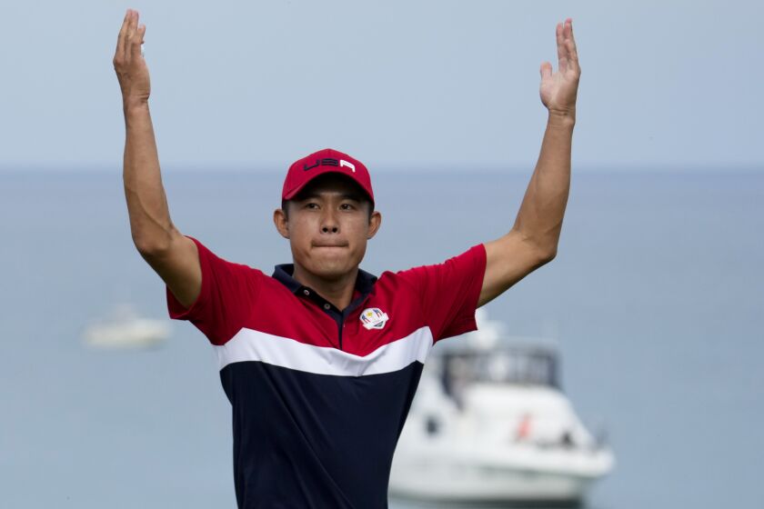 Team USA's Collin Morikawa reacts after winning the 17th hole during a Ryder Cup.