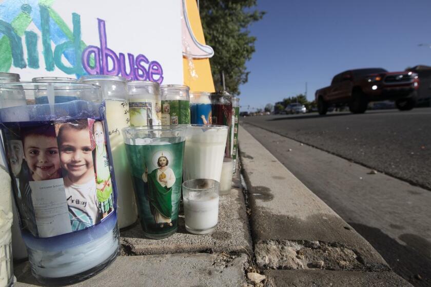 LANCASTER, CALIF. -- FRIDAY, JUNE 29, 2018: A memorial shrine for murdered 10-year-old Anthony Avalos, is assembled on a sidewalk near Avalos' home on Challenger Way near Ave. K in Lancaster, Calif., on June 29, 2018. Anthony's mother and her boyfriend have been arrested in connection with his death. (Brian van der Brug / Los Angeles Times)