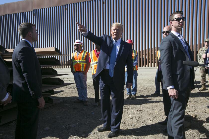 President Trump spoke to the media about the new border fence and pointed south towards Mexico on Wednesday, September 18, 2019, east of the Otay Mesa Port of Entry in San Diego, CA.