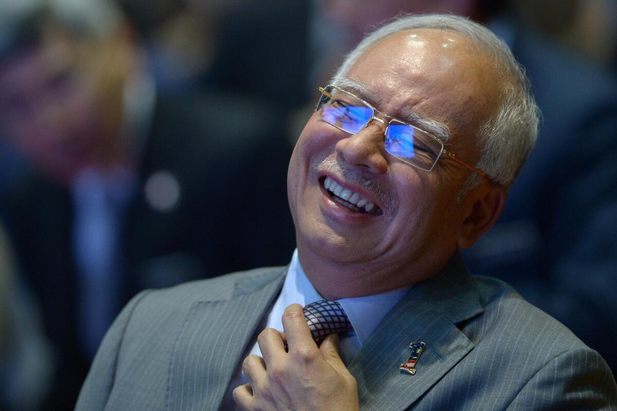 Malaysian Prime Minister Najib Razak smiles before addressing journalists in Putrajaya, Malaysia, on Jan. 28, 2016.