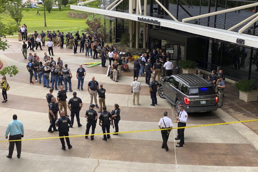 Emergency personnel respond to a shooting at the Natalie Medical Building on the St. Francis Hospital campus Wednesday