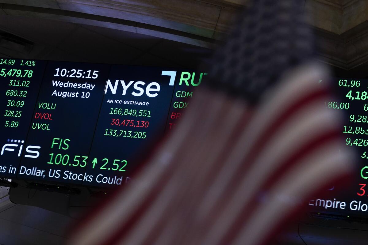 A screen displays market data at the New York Stock Exchange