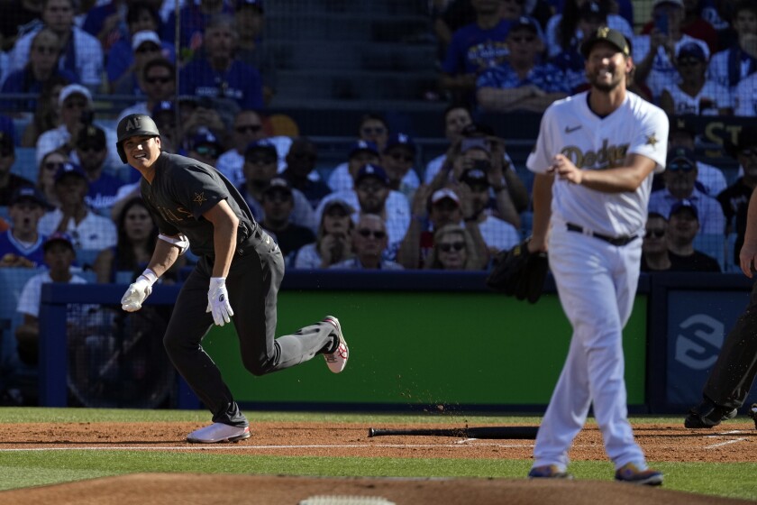 The AL's Shohei Ohtani runs to first base after singles against NL starting pitcher Clayton Kershaw.