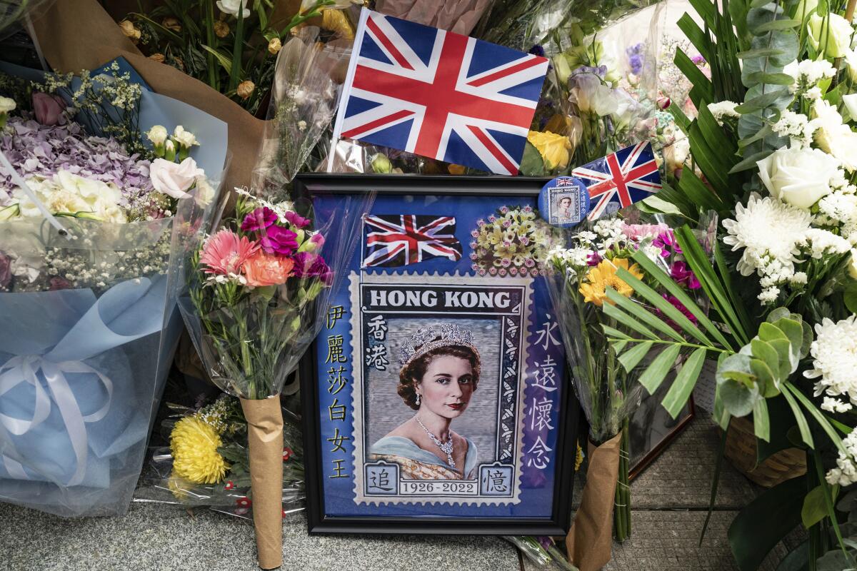Flowers and a photograph are placed for the queen.