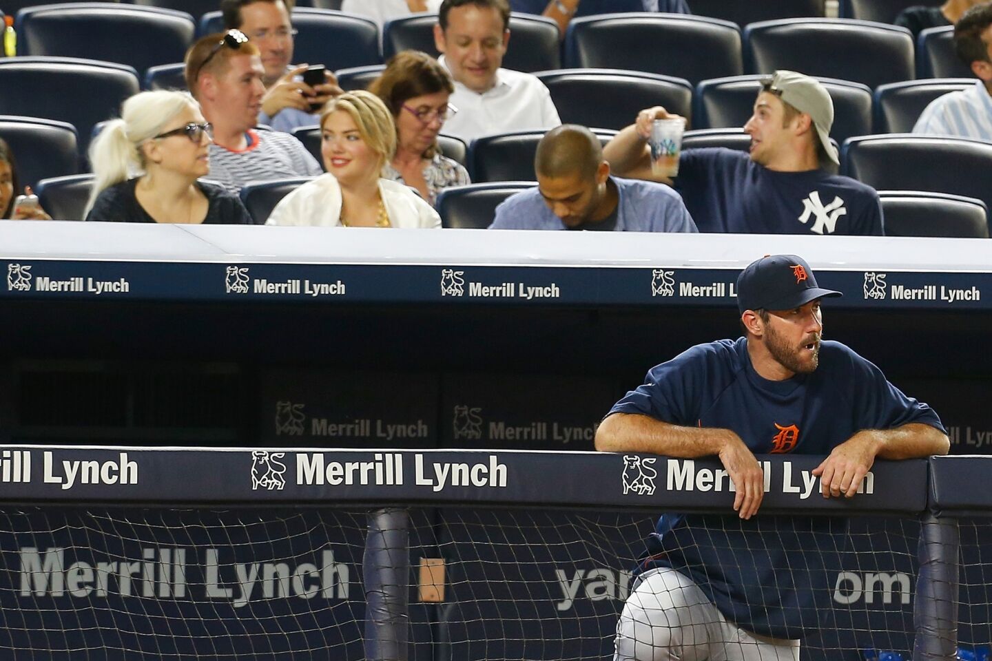 Kate Upton attends a game between the Detroit Tigers and the New York Yankees in the Bronx as her boyfriend, Justin Verlander of the Tigers, looks on from the dugout at Yankee Stadium on Aug. 4.
