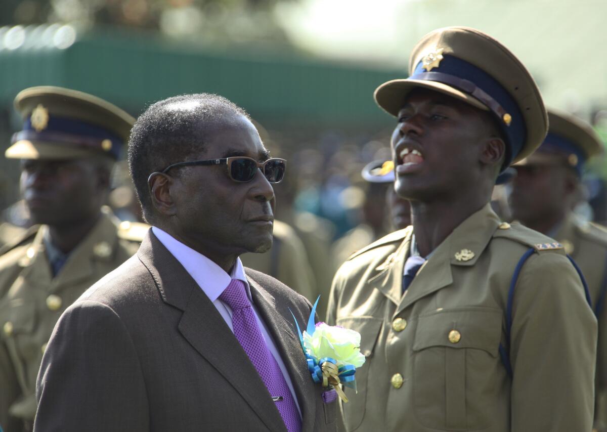 Zimbabwean President Robert Mugabe inspects an honor guard of police officers Thursday in Harare, the country's capital.