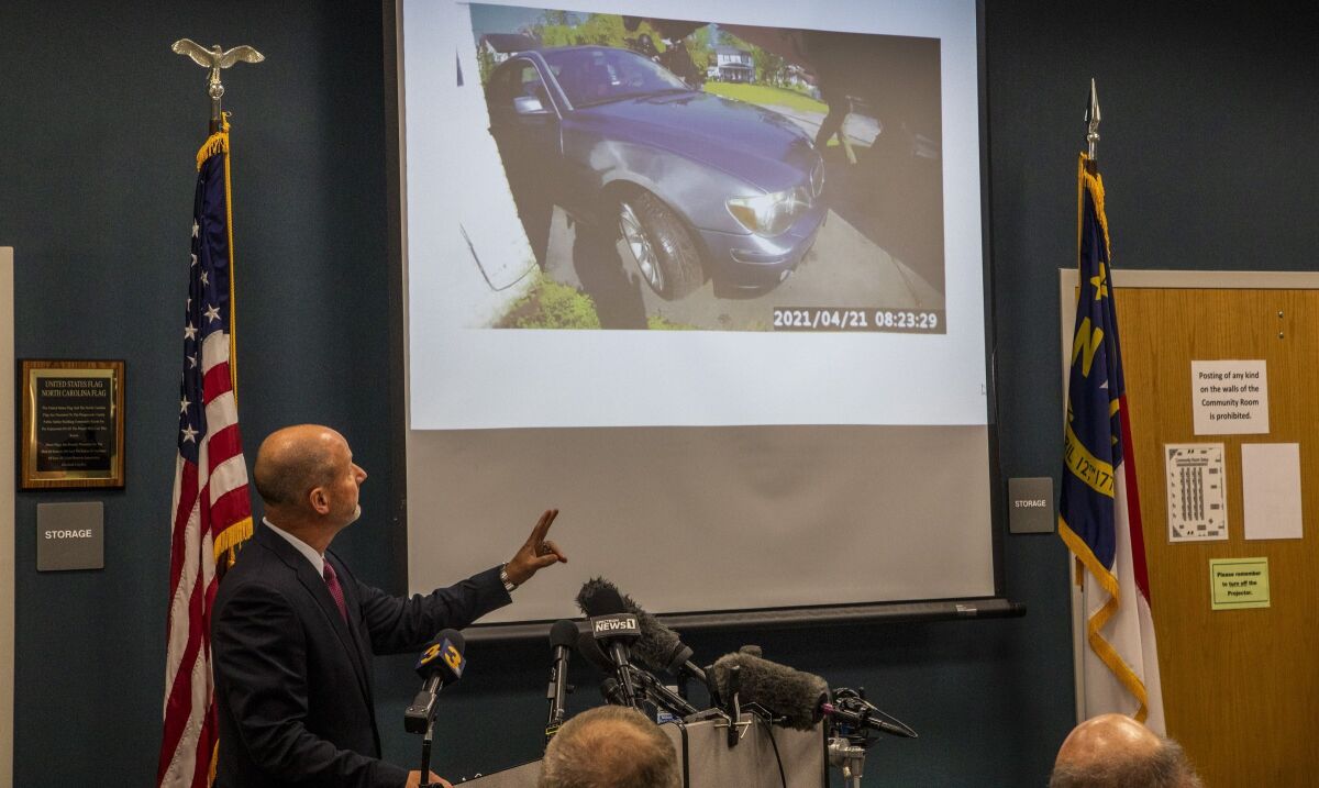 Pasquotank County District Attorney Andrew Womble shows still images from police body camera footage after announcing he will not charge deputies in the April 21 fatal shooting of Andrew Brown Jr. during a news conference Tuesday, May 18, 2021 at the Pasquotank County Public Safety building in Elizabeth City, N.C. Womble said he would not release bodycam video of the confrontation between Brown, a Black man, and the law enforcement officers. (Travis Long/The News & Observer via AP)