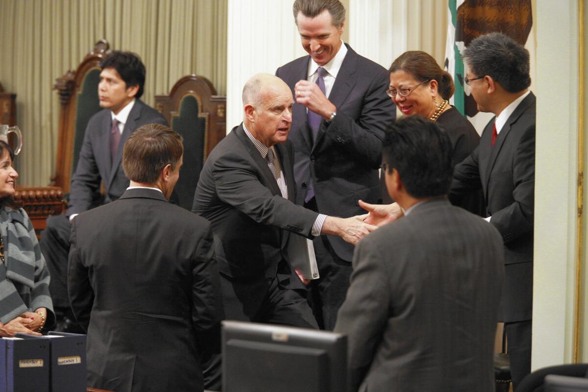 Gov. Jerry Brown shakes hands at his State of the State address before a joint session of the California Legislature in Sacramento on Jan. 21.
