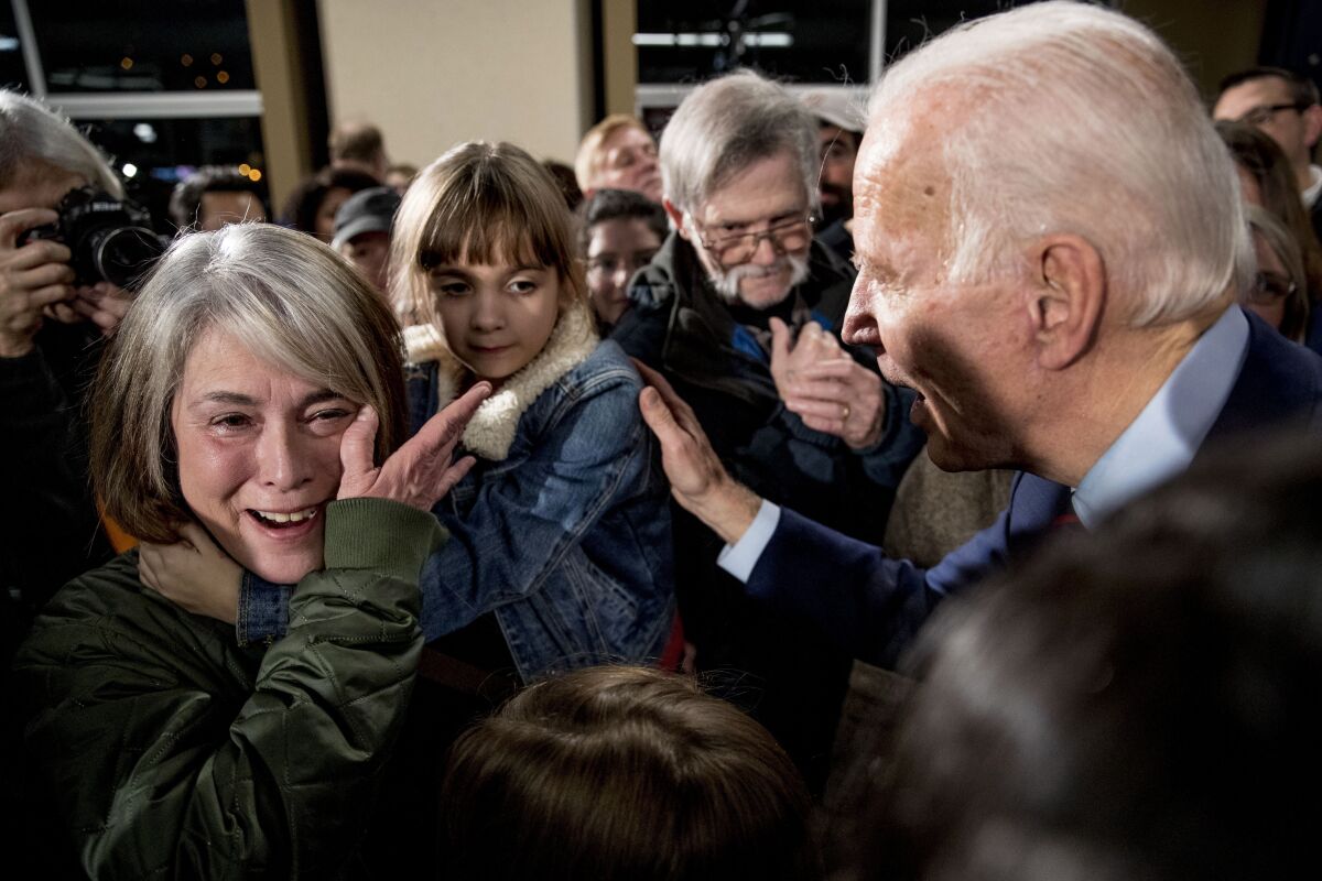Rose Boehle of Davenport, Iowa, becomes emotional as she speaks with former Vice President Joe Biden