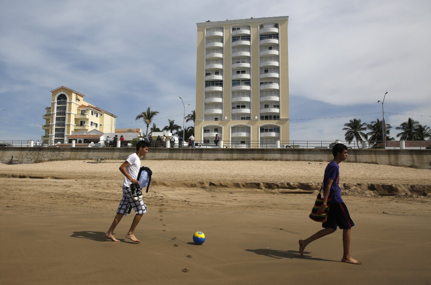 Locals play on the beach in front of the condominium complex where Sinaloa cartel leader Joaquin "El Chapo" Guzman was captured.