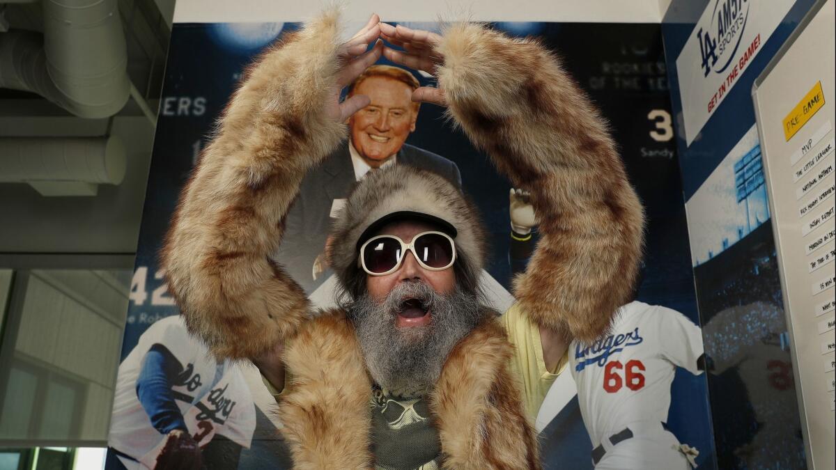 Radio sports announcer Vic "the Brick" Jacobs is all decked out in his fox fur outfit, while at iHeartMedia in Burbank, where he gives sports updates.