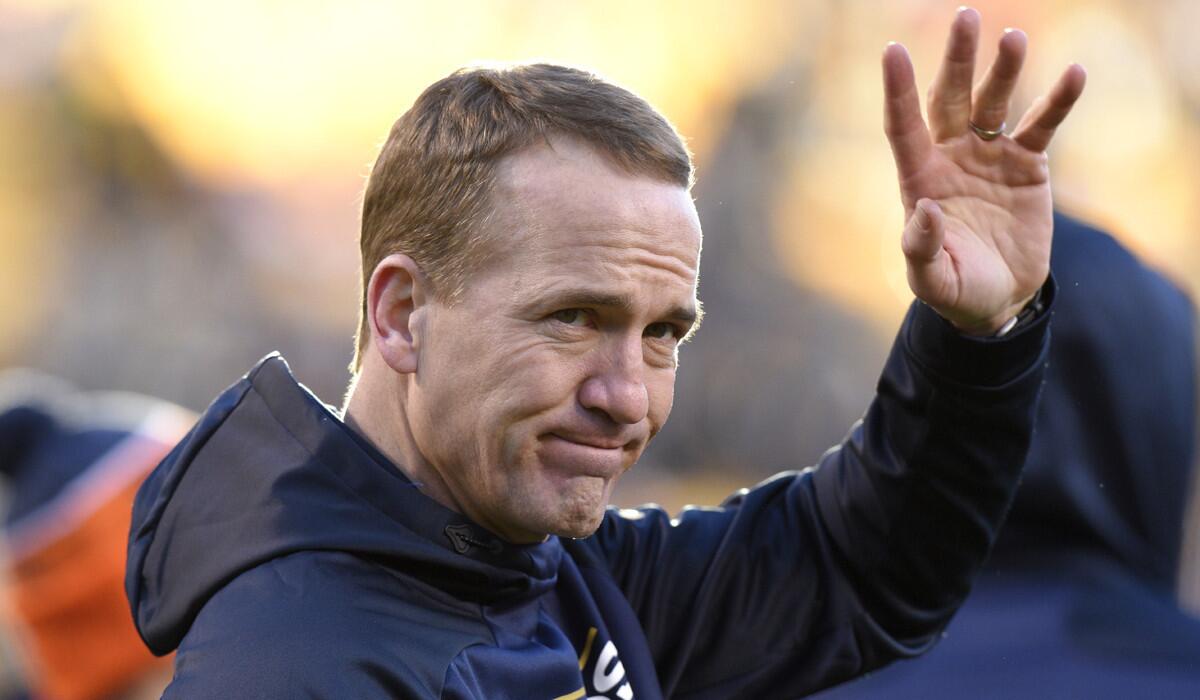 Denver Broncos quarterback Peyton Manning waves before a game against the Pittsburgh Steelers on Dec. 20.