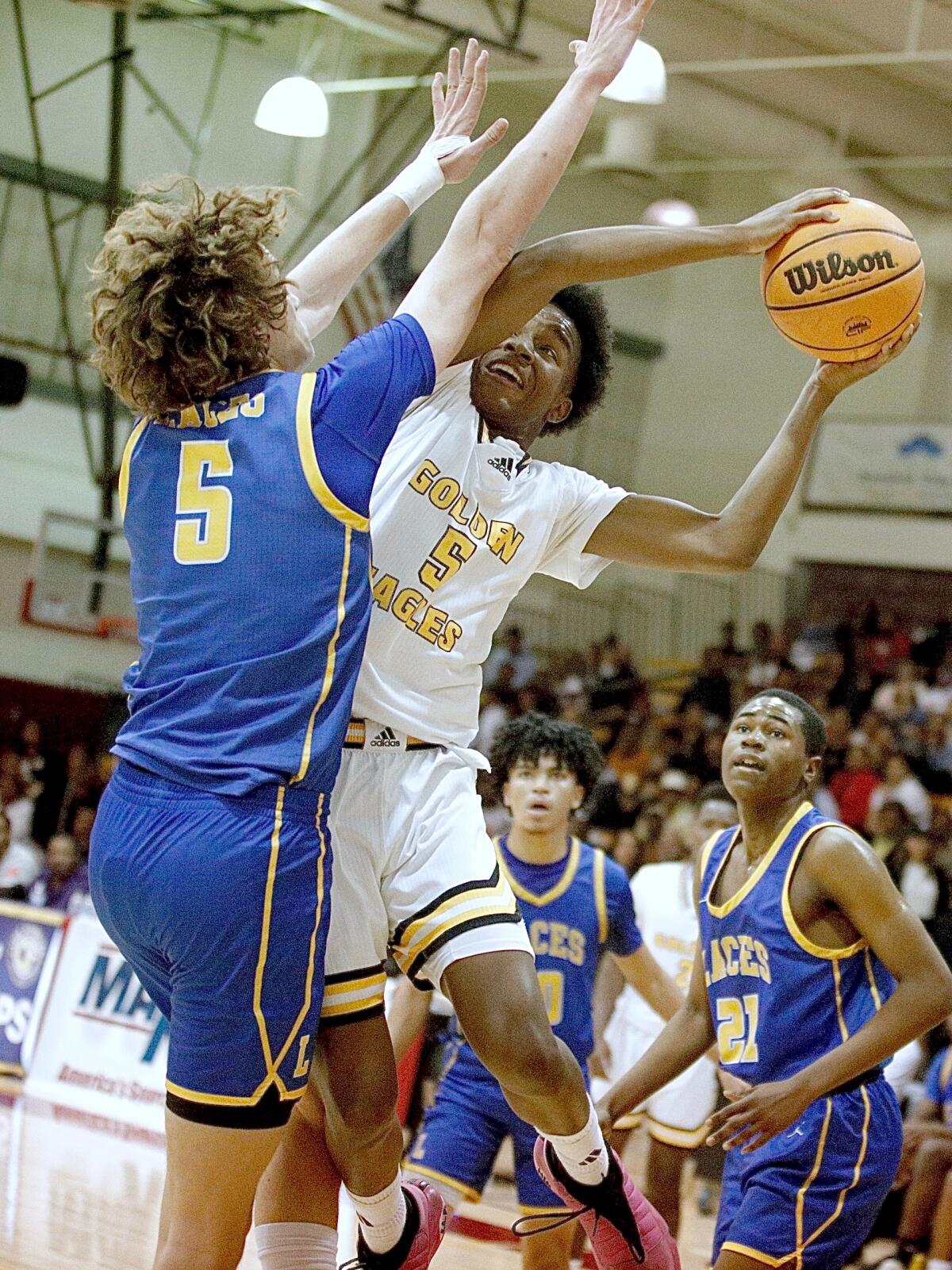 King/Drew guard Jayshawn Kibble tries to shoot over LACES defender Ryan Conner.