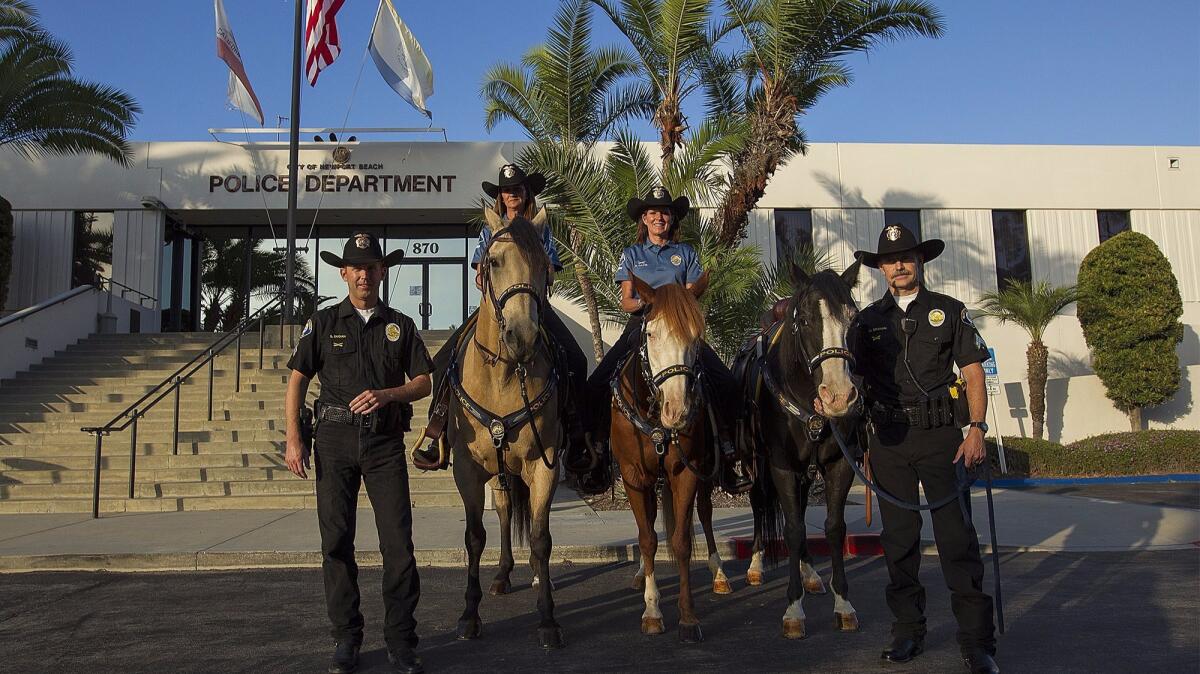Newport Beach police Officer Shawn Dugan, left, volunteers Lori Hayden, on Huck, and Bonnie Davis, on Cricket, and Officer Matthew Graham, with Stogie, make up the Newport Beach police mounted unit.