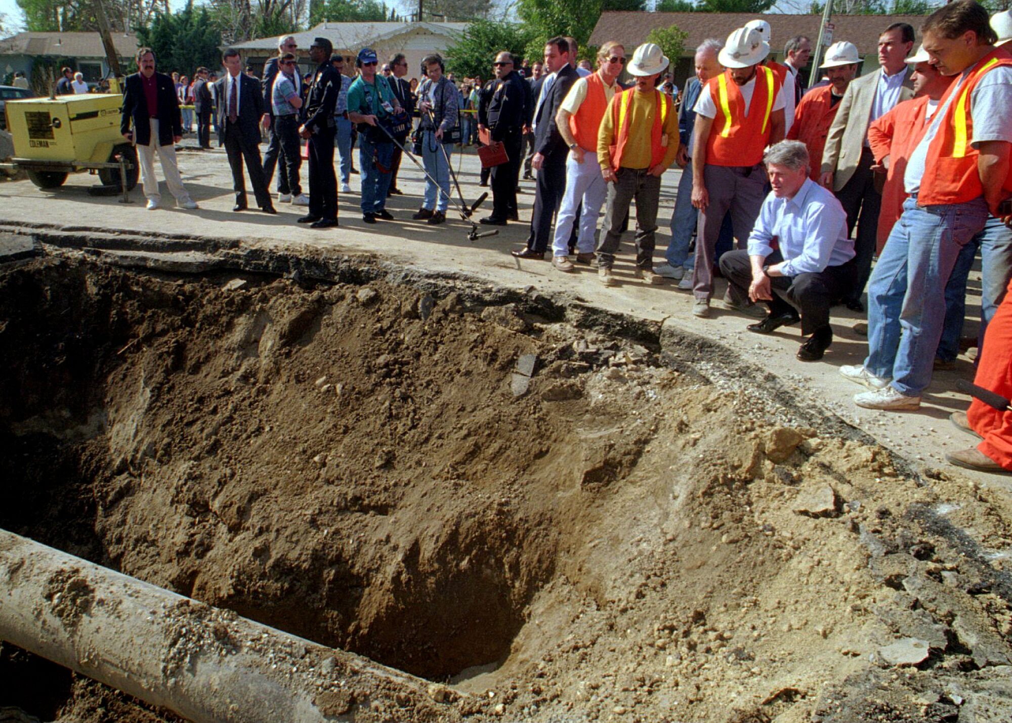 President Bill Clinton surveys damage after the Northridge earthquake
