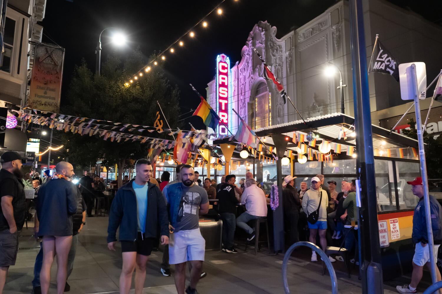 SAN FRANCISCO, CALIF OCTOBER 3, 2025 -- Patrons socialize across from the San Francisco's iconic Castro Theatre is scheduled to be reopen in 2026 following a $41 million renovation that restored historic features on Friday, Oct. 3, 2025 in San Francisco, Calif. (Paul Kuroda/For The Times)