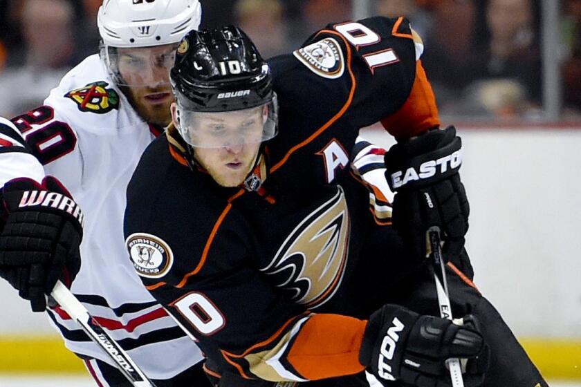 Ducks forward Corey Perry controls the puck in front of Chicago Blackhawks forward Brandon Saad during Game 2 of the Western Conference finals at Honda Center on May 19.