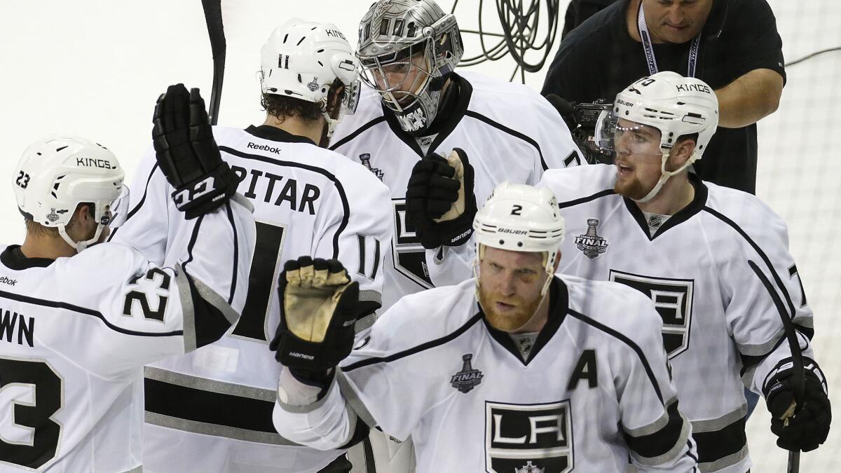 Kings players celebrate following their win over the New York Rangers in Game 3 of the Stanley Cup Final in June. Several Western Conference teams have bolstered their rosters in an effort to knock the Kings off their throne.