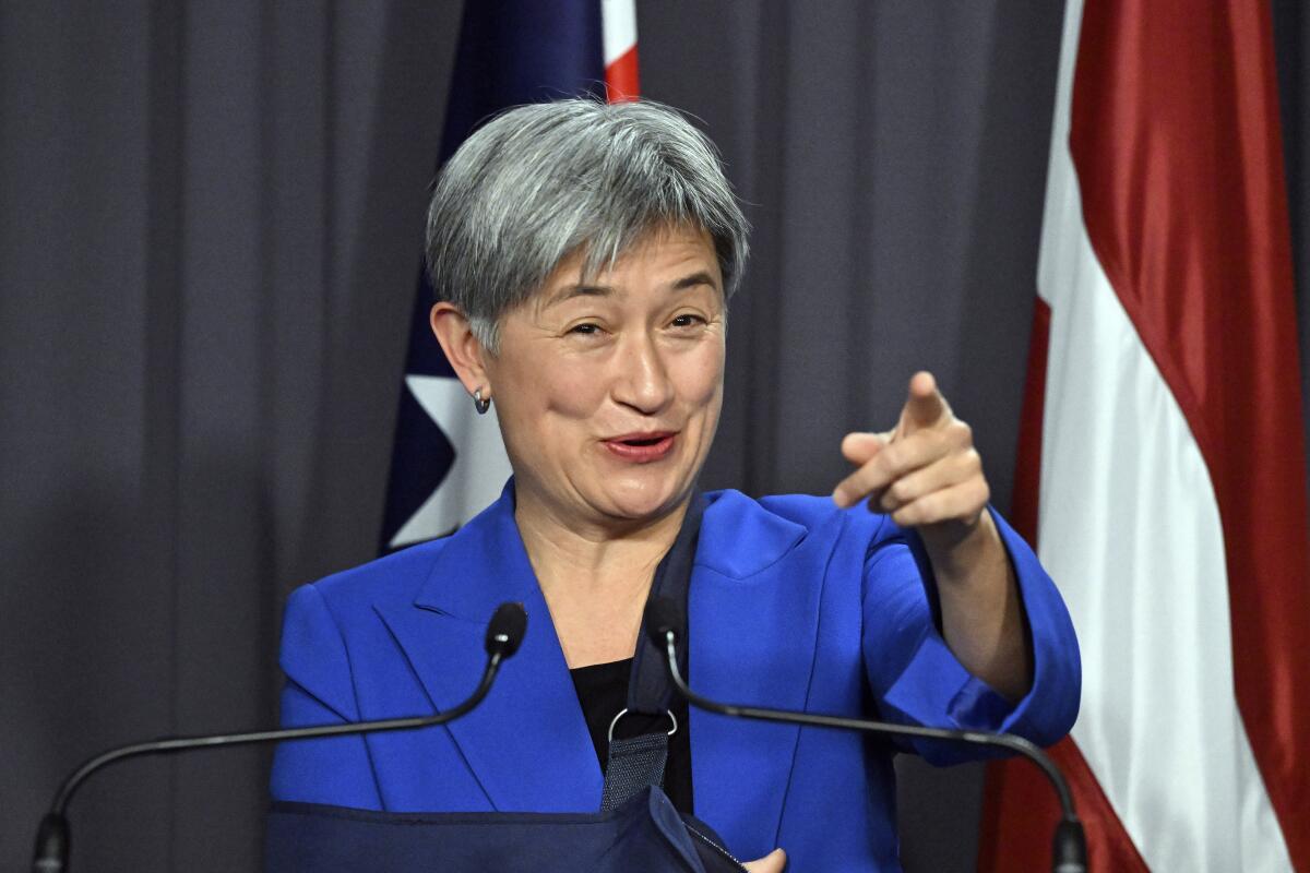 Australia's Foreign Minister Penny Wong gestures during a press conference at Parliament House in Canberra, Monday, Aug. 8, 2022. Wong has called for a cooling of tensions after Beijing accused her of "finger-pointing" in her criticisms of China's military response to U.S. House Speaker Nancy Pelosi's visit to Taiwan. (Mick Tsikas/AAP Image via AP)
