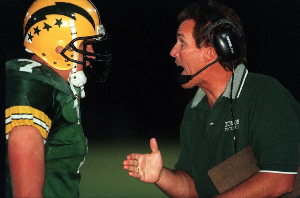 Edison coach Dave White talks to a player in 1998.