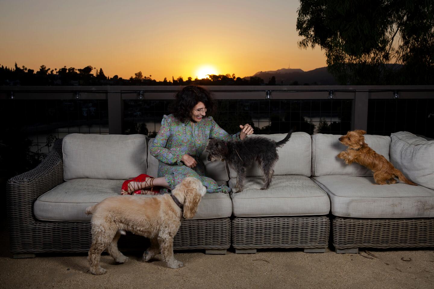 Actress Lisa Edelstein and her pets enjoy her back patio that overlooks the Silver Lake reservoir.