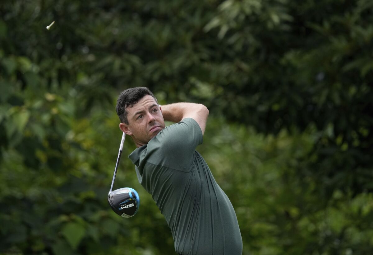 Rory McIlroy of Ireland watches his tee shot on the first hole during the third round of the men's golf event at the 2020 Summer Olympics on Saturday, July 31, 2021, in Kawagoe, Japan. (AP Photo/Andy Wong)