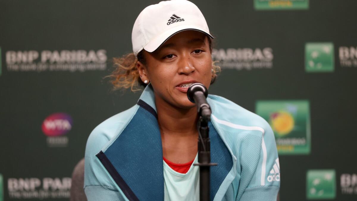 Naomi Osaka fields questions from the media at a press conference during the BNP Paribas Open at the Indian Wells Tennis Garden on Thursday in Indian Wells.