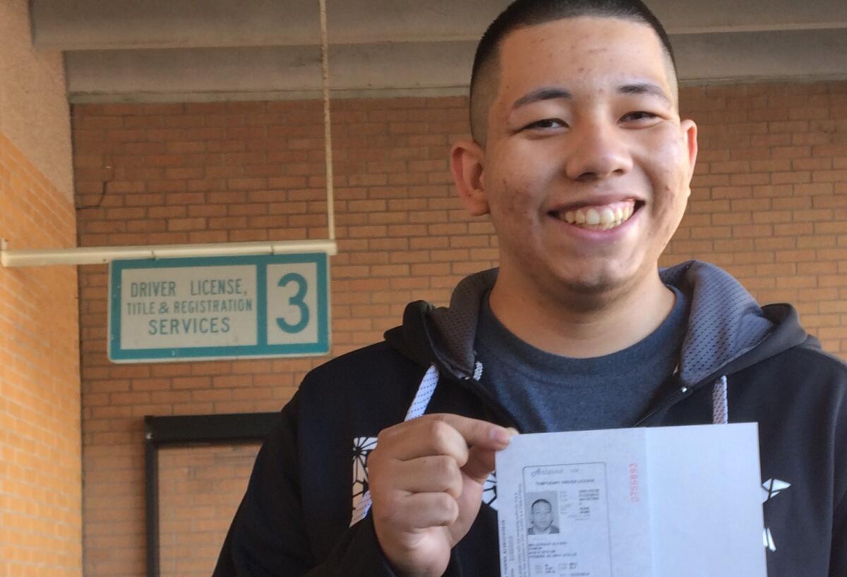 Ramon Maldonado waited in line at a Phoenix motor vehicles office starting at 5:30 a.m. Monday. He applied for a driver's license and passed the test.