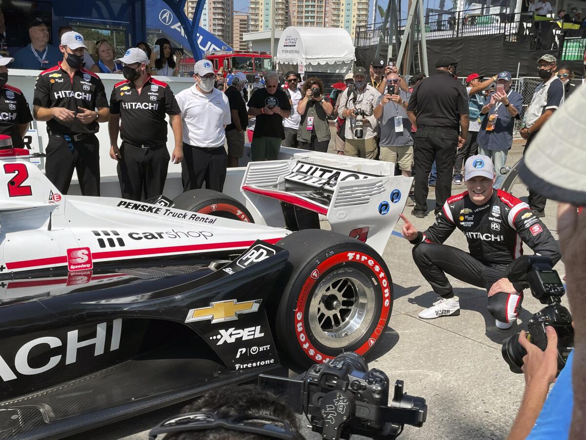Josef Newgarden celebrates after winning the pole for the Grand Prix of Long Beach on Saturday.