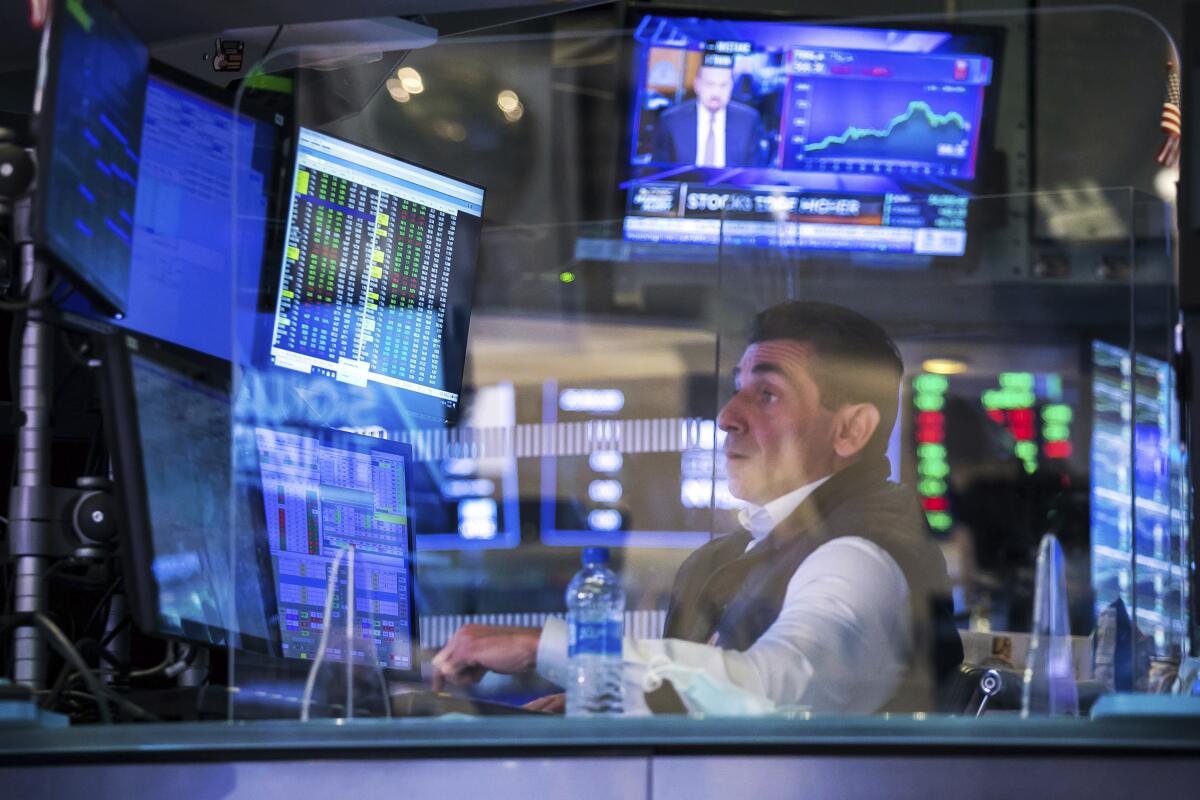 Specialist Peter Mazza works at the New York Stock Exchange