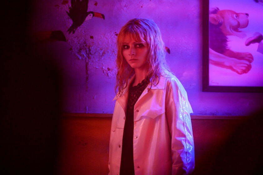 Thomasin McKenzie looks to the side in a scene from 'Last Night in Soho'