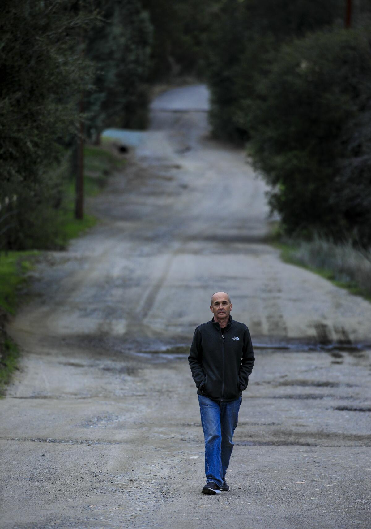 Don Winslow walks down a road in northeastern San Diego County