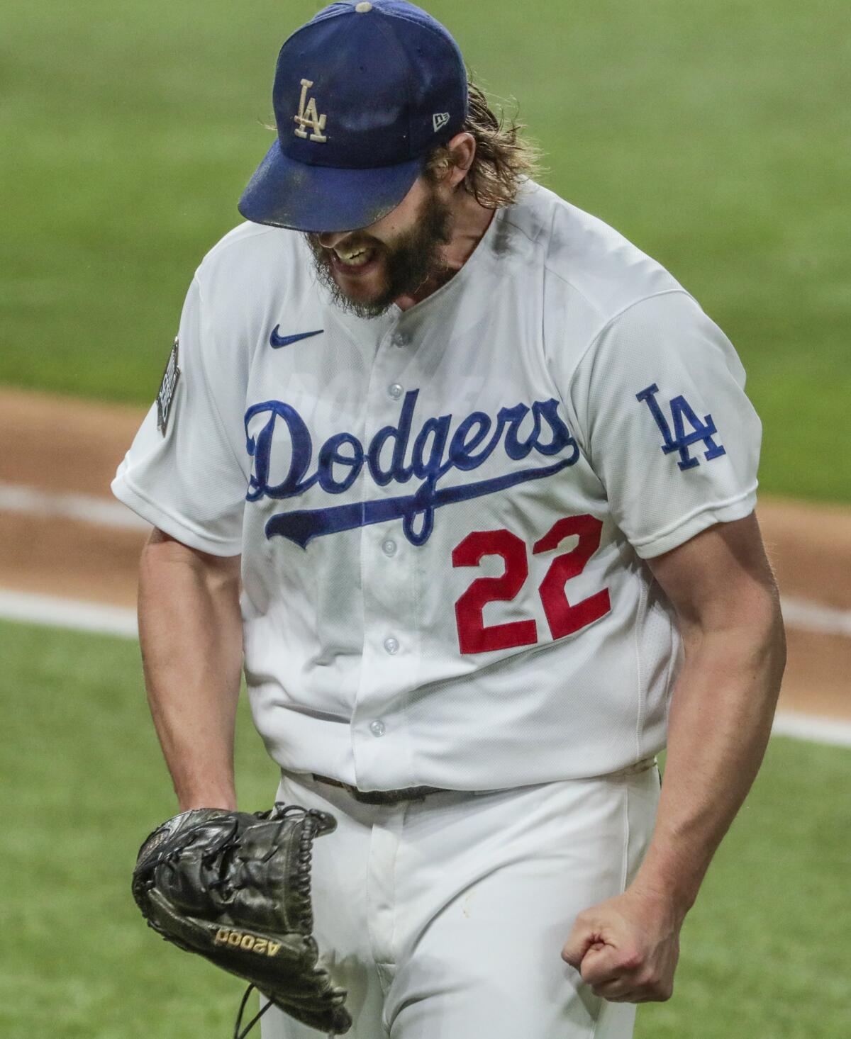 Dodgers starting pitcher Clayton Kershaw yells out in frustration as he heads to the dugout.