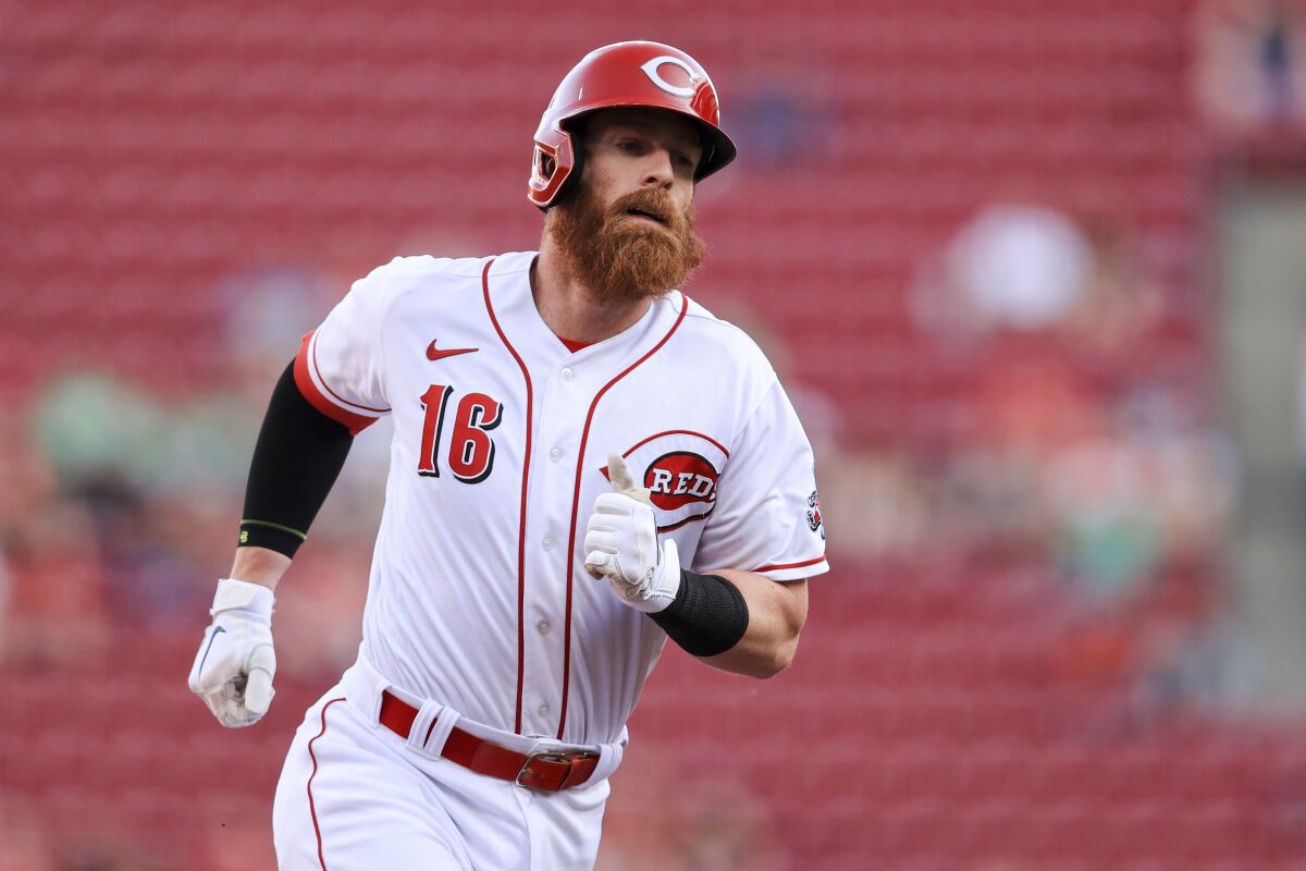 Cincinnati Reds' Colin Moran runs the bases after hitting a solo home run during the second inning of a baseball game against the Milwaukee Brewers in Cincinnati, Monday, May 9, 2022. (AP Photo/Aaron Doster)