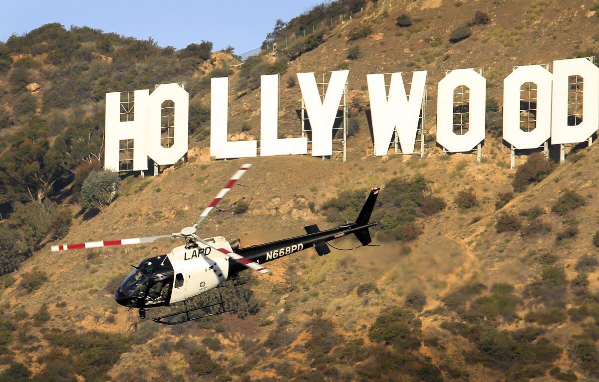  An LAPD helicopter searches a canyon in Griffith Park in 2011. 