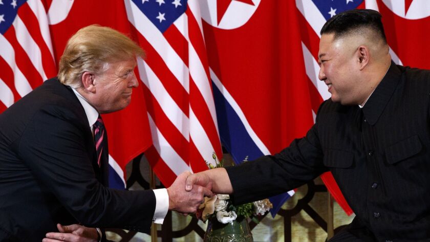 U.S. President Donald Trump shakes hands with North Korean leader Kim Jong Un in Hanoi on Feb. 27.