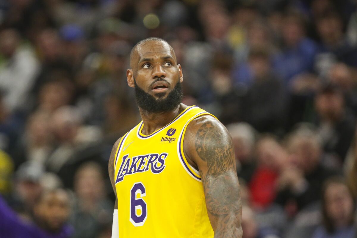 Los Angeles Lakers forward LeBron James looks up during an NBA basketball game.