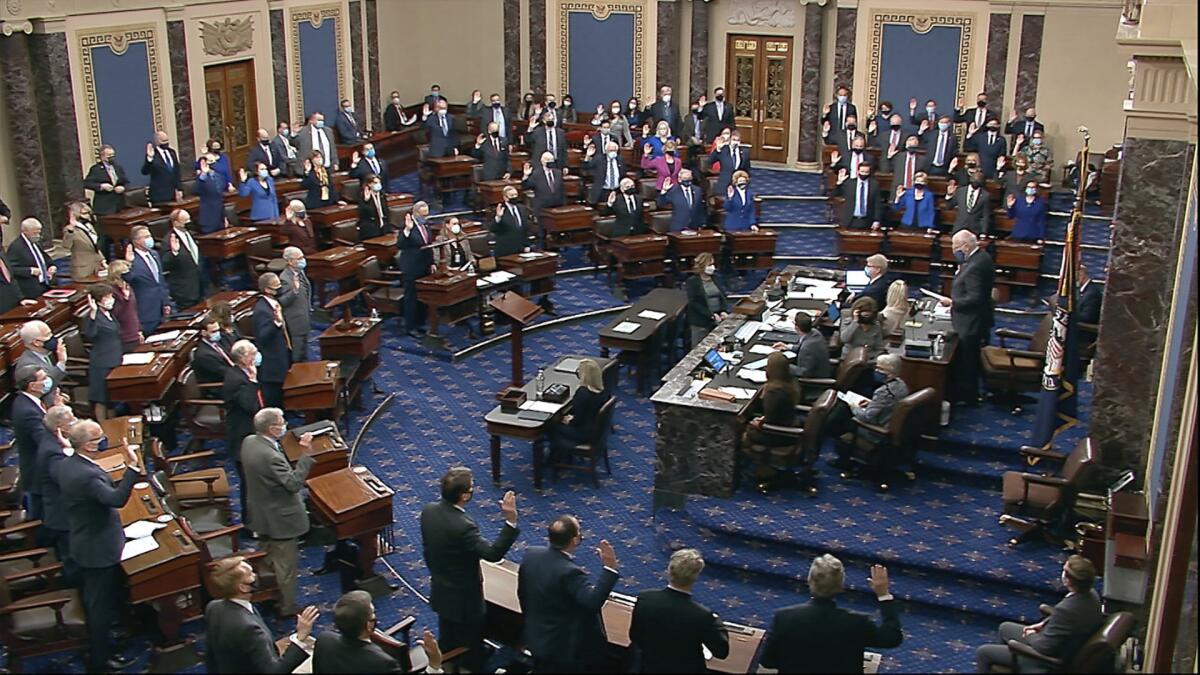 Sen. Patrick Leahy swears in members of the Senate for the impeachment trial of Donald Trump on Jan. 26.