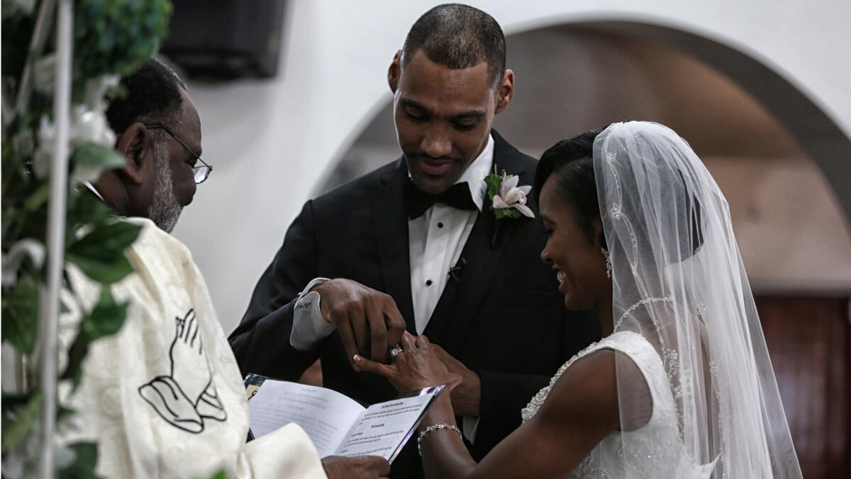 Jamie Nieto Shevon Stoddard are married by Bishop Donnie McGriff at the Greater Christ Temple Apostolic Church.