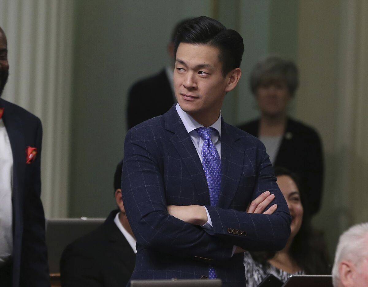 FILE - In this Aug. 31, 2018, file photo, Assemblyman Evan Low, D-Campbell, watches the debate over a bill during the Assembly session in Sacramento, Calif. California is the first state to require large department stores to display products like toys and toothbrushes in gender neutral ways. Gov. Gavin Newsom signed the law on Saturday, Oct. 9, 2021. This is the third time Democrats in the state Legislature have tried to pass this law, with similar bills failing in 2019 and 2020. Low authored the bill this year. He said he was inspired by the 10-year-old girl daughter of one of his staffers, who asked her mom why certain items in the store were "off limits" to her because she was a girl. (AP Photo/Rich Pedroncelli, File)