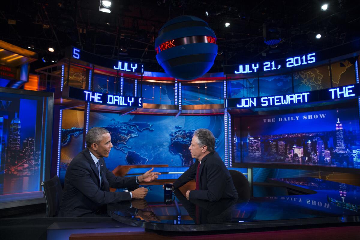 President Barack Obama, left, talks with Jon Stewart, host of The Daily Show, during a taping, on Tuesday, July 21, 2015, in New York. (AP Photo/Evan Vucci)
