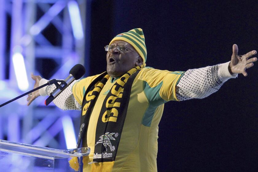 FILE - Retired Anglican Archbishop Desmond Tutu of South Africa gestures during the opening concert for the soccer World Cup at Orlando stadium in Soweto, South Africa, Thursday, June 10, 2010. Tutu, South Africa’s Nobel Peace Prize-winning activist for racial justice and LGBT rights and retired Anglican Archbishop of Cape Town, has died, South African President Cyril Ramaphosa announced Sunday, Dec. 26, 2021. He was 90. (AP Photo/Hassan Ammar, File)