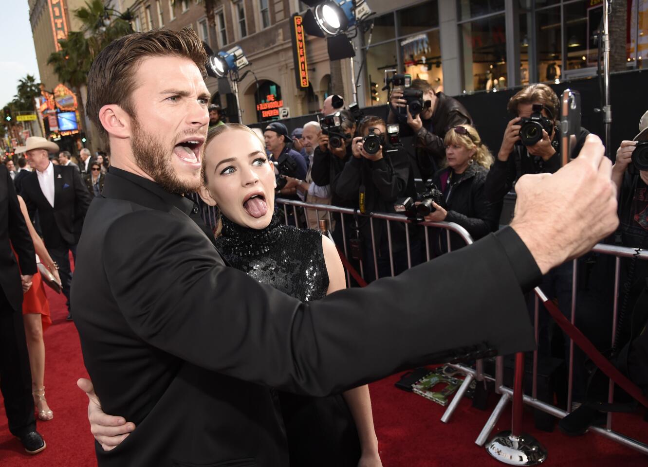 Scott Eastwood, left, and Britt Robertson take a wacky selfie on the red carpet April 6.