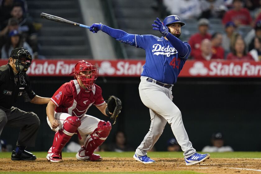 Los Angeles Dodgers' Edwin Rios (43) bats during a spring training baseball game against the Los Angeles Angels in Anaheim, Calif., Monday, April 4, 2022. (AP Photo/Ashley Landis)